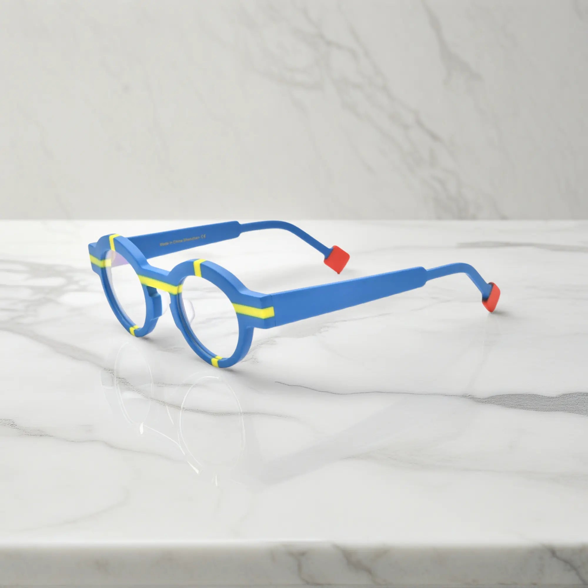 Side profile highlighting cobalt blue acetate temples and modern matte surface.